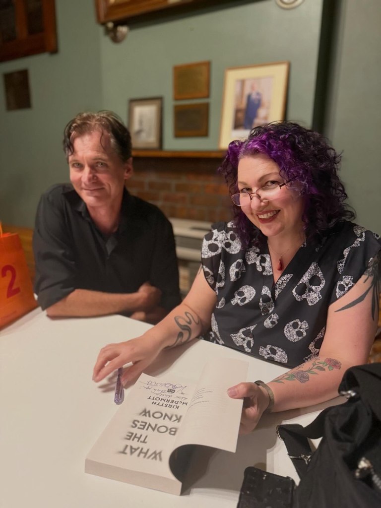Kirstyn McDermott signing a copy of her novel for Dillon Naylor.
Photo by Collins Booksellers